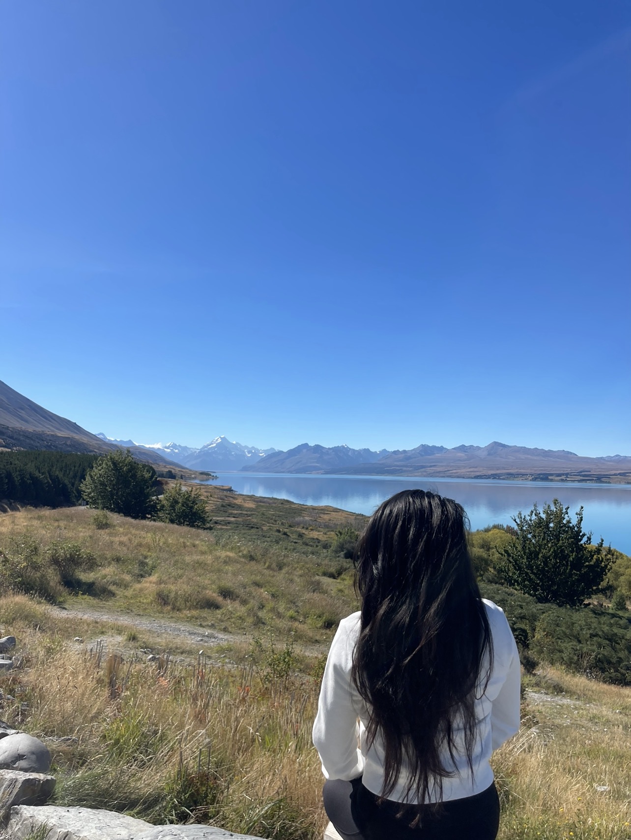 Suruchi overlooking a lake