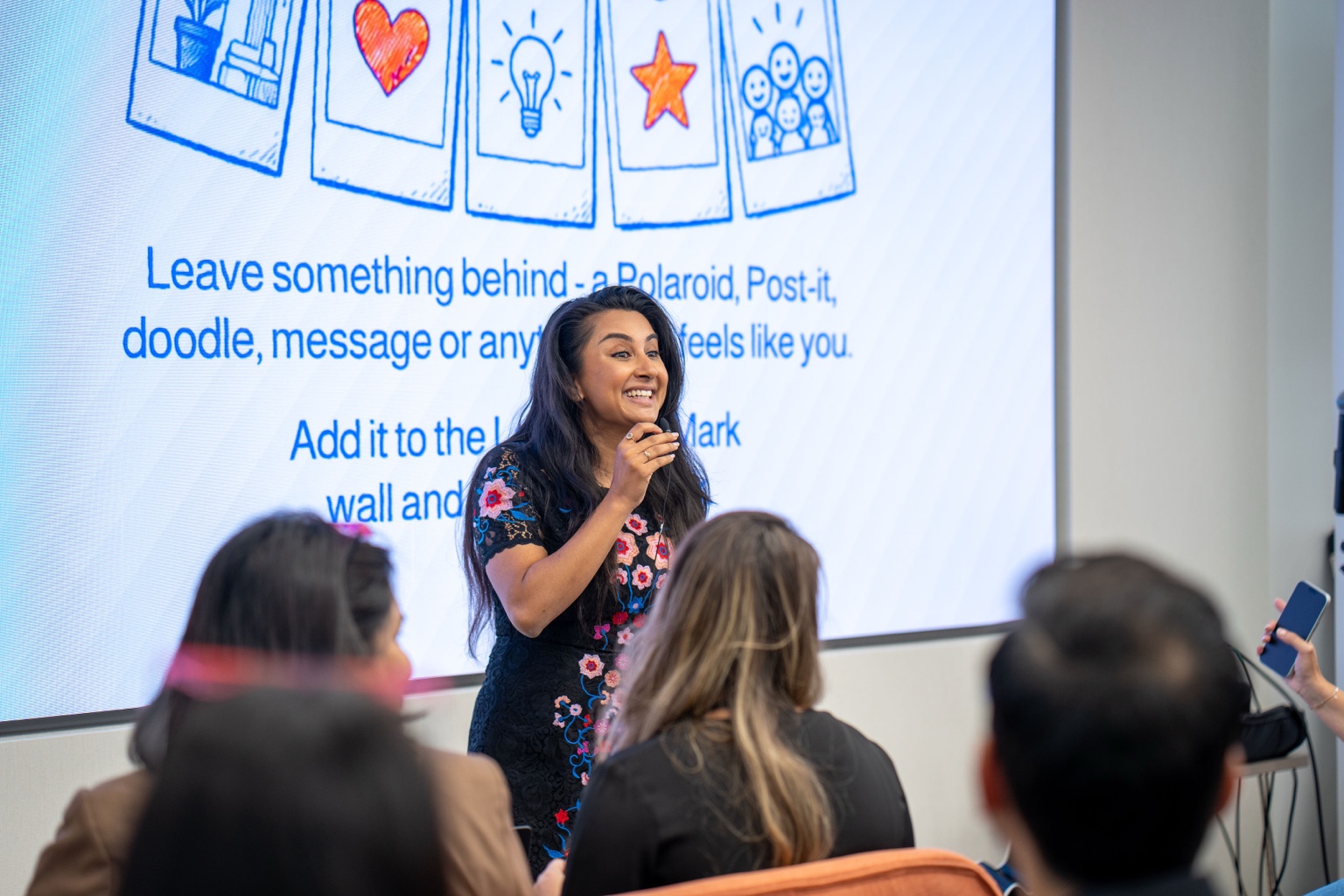 Suruchi speaking to a group at a professional event